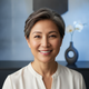 A smiling, happy middle-aged woman in a portrait headshot, representing a satisfied customer.